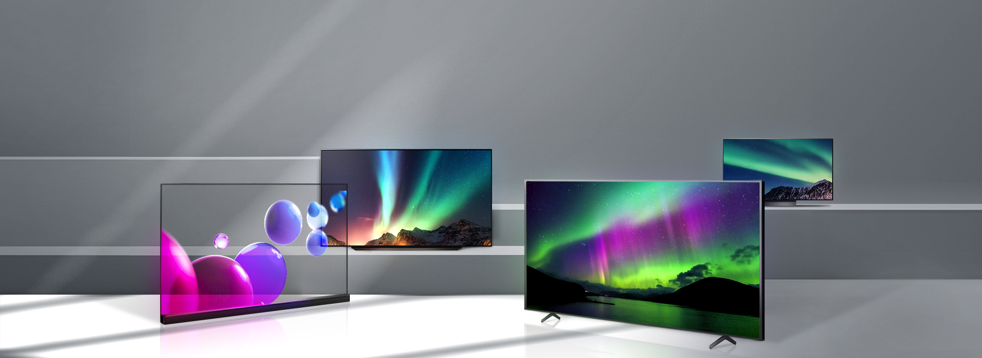 계단에 LG디스플레이의 OLED 패널이 사용된 TV 여러 대가 놓여있고, 화면에는 다채로운 색감의 그래픽 이미지가 떠 있다.